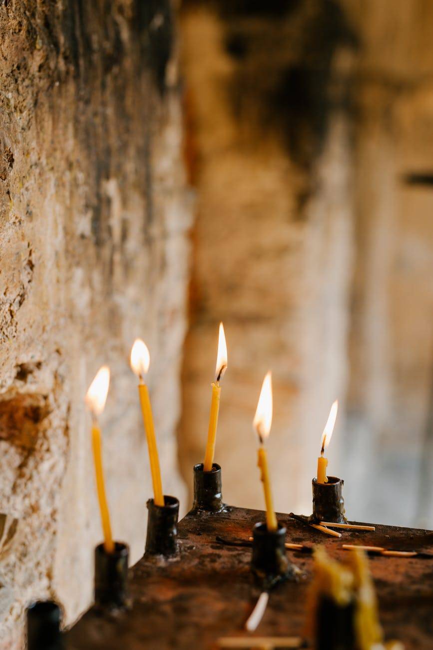 burning candles at praying place in church